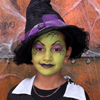 Child wearing a skeleton skull face paint design from the Halloween kit