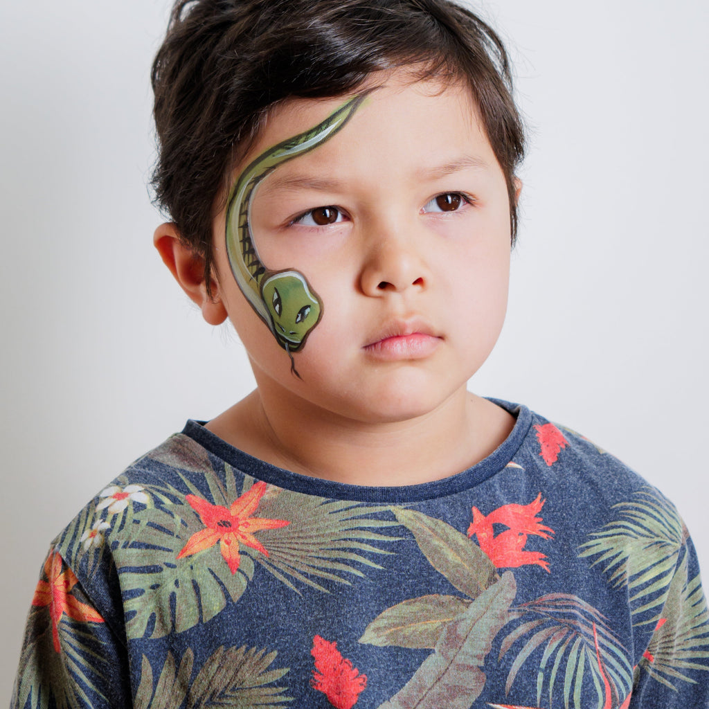 Child wearing a giraffe face paint design made with the Animal Kingdom kit