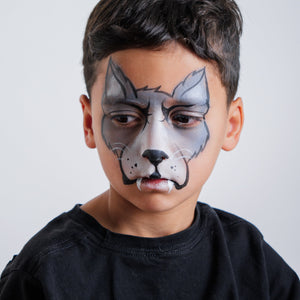Child wearing a cheetah face paint design from the Animal Kingdom kit