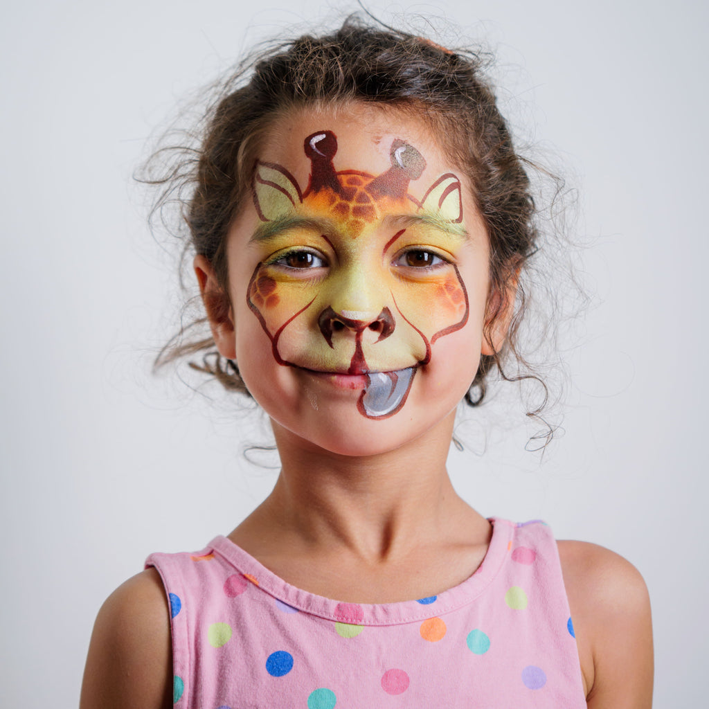 Parent painting a child's face at home using the Palette Pals Animal Kingdom kit