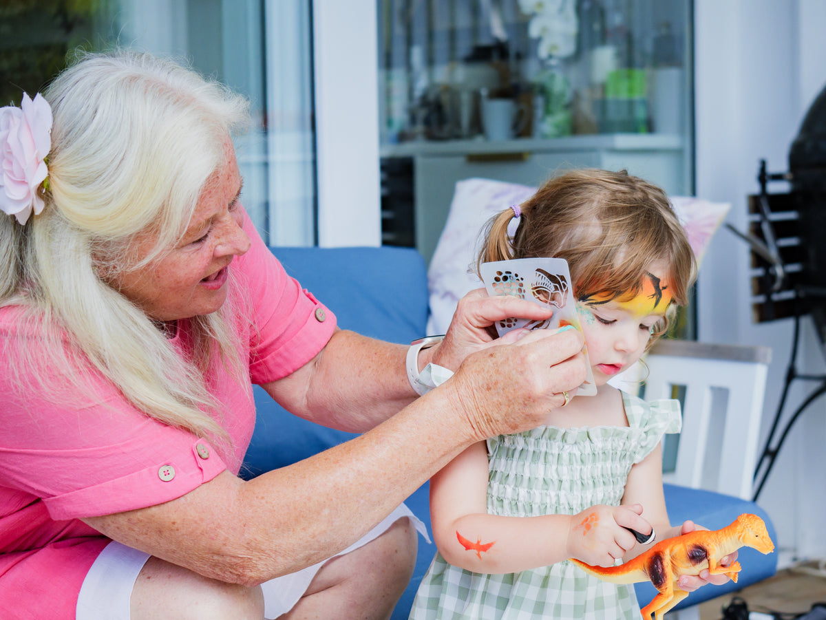 A child enjoying imaginative play with face paint