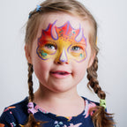 Child wearing a dinosaur face paint design made with the Dino & Dragon kit
