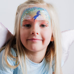 Child wearing a unicorn face paint design created with the FairyTales kit