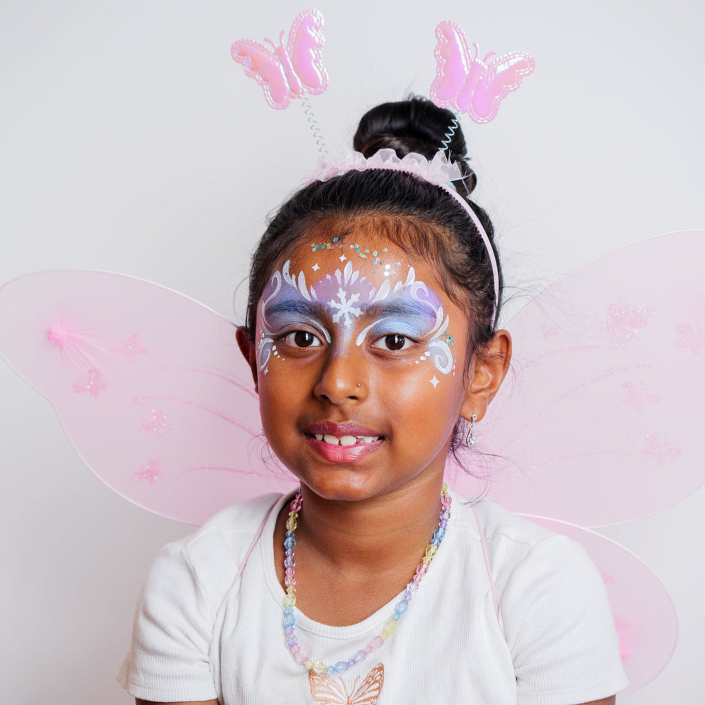 Child wearing a princess face paint design made with the FairyTales kit