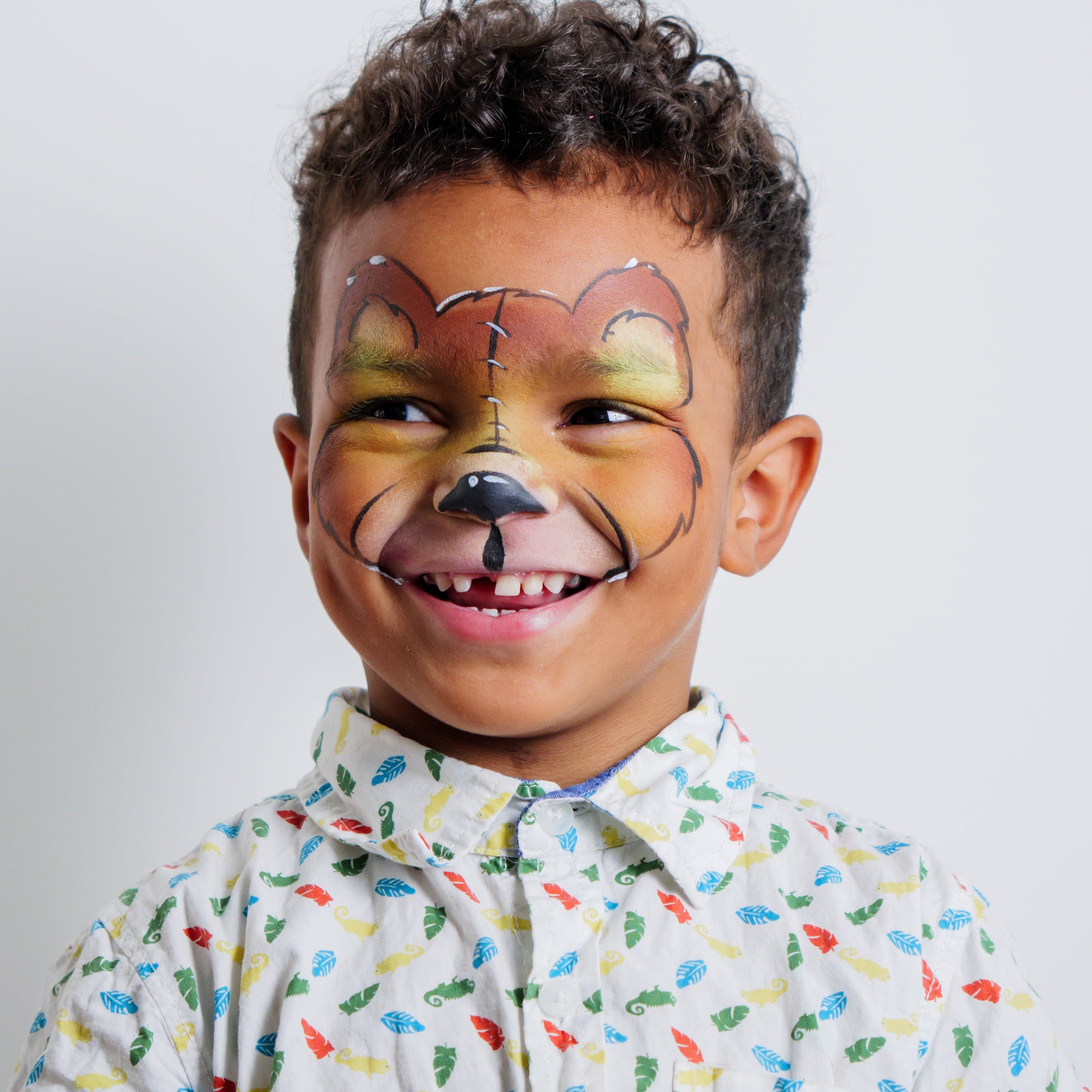 Child wearing a butterfly face paint design created with the Garden Party kit