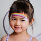 Child wearing a butterfly face paint design created with the Imagination kit