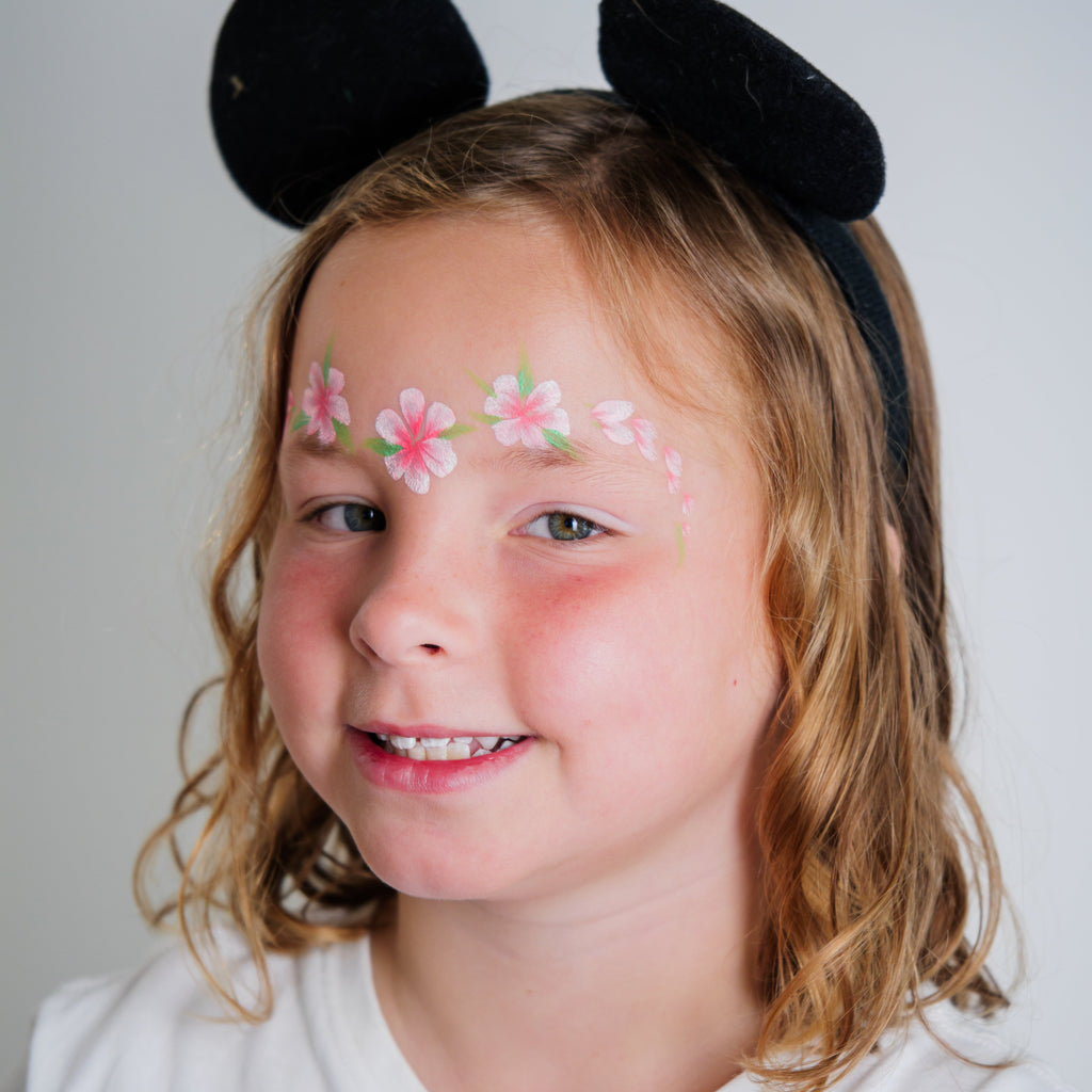 Parent painting a child's face at home using the Palette Pals Imagination kit