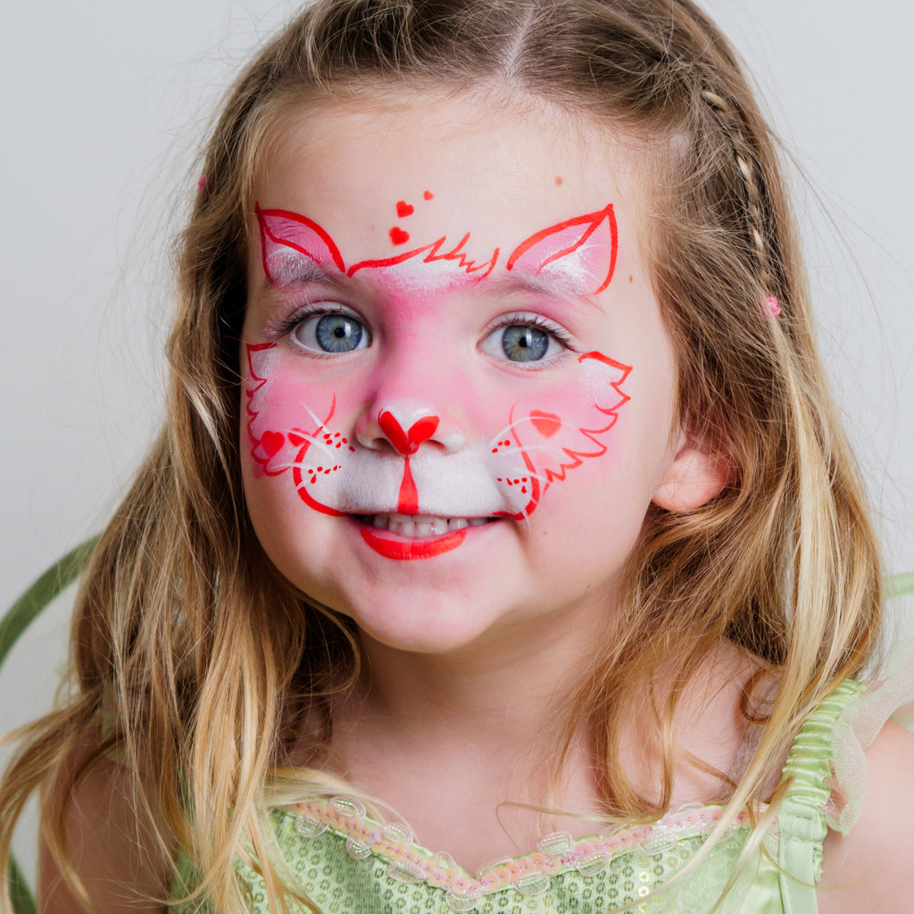 Two children showing off face paint designs made with the Imagination kit