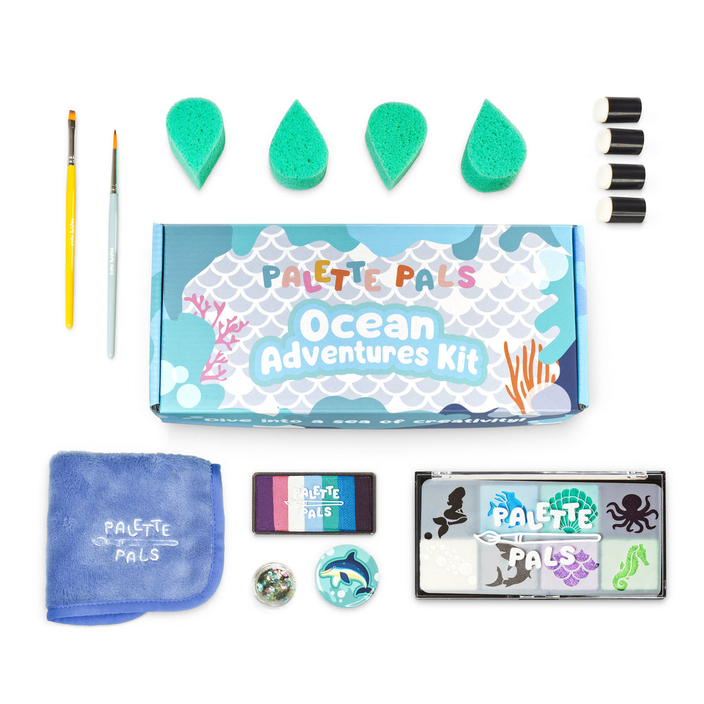 Flat lay of the Oceans Adventure kit: face paint palette, brushes, sponges, reusable stencils and design cards