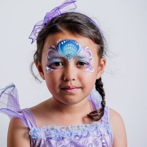 Child wearing a mermaid face paint design created with the Oceans Adventure kit
