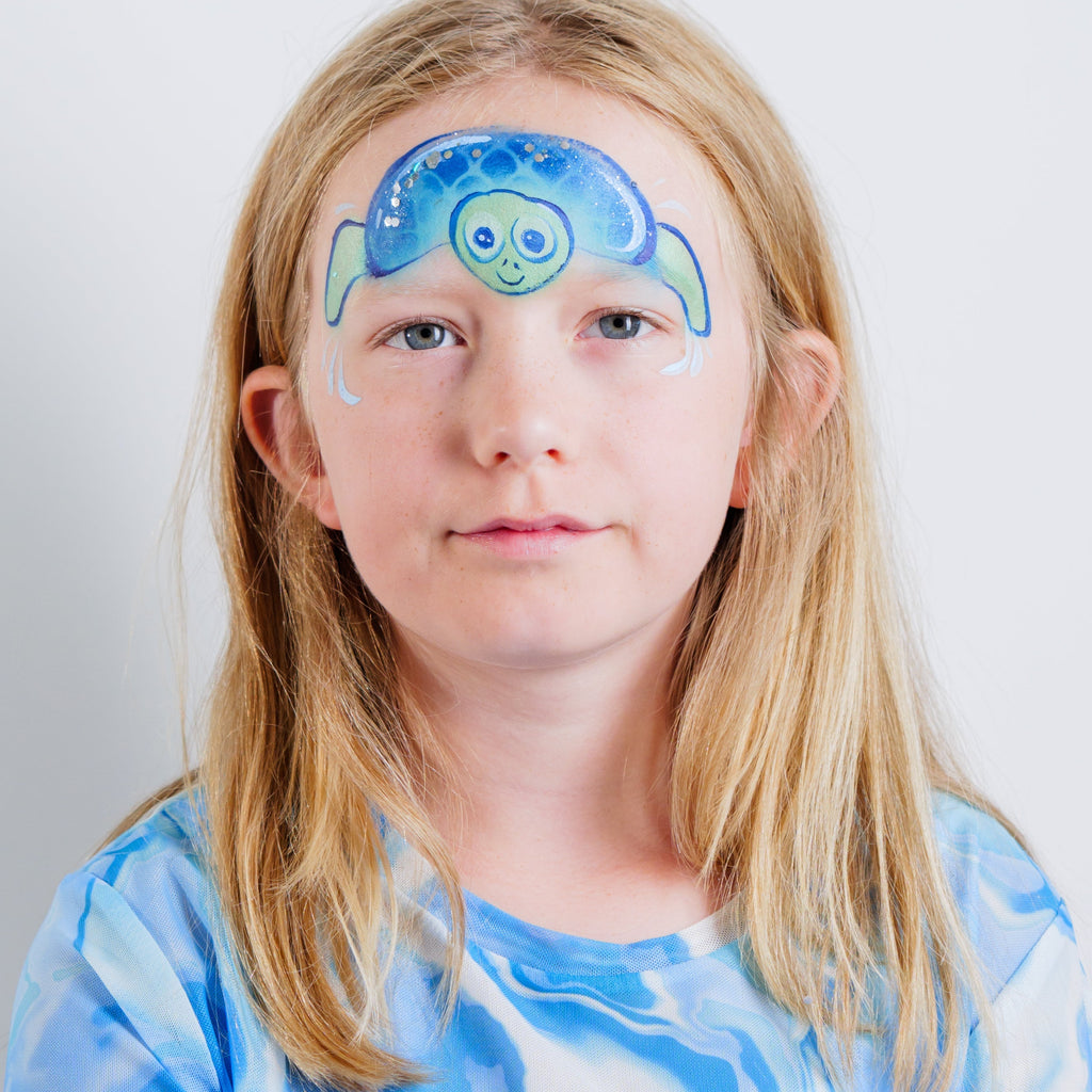 Child wearing a shark face paint design made with the Oceans Adventure kit