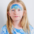 Child wearing a shark face paint design made with the Oceans Adventure kit