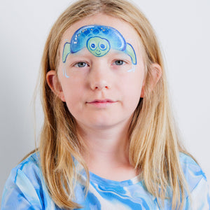 Child wearing a shark face paint design made with the Oceans Adventure kit