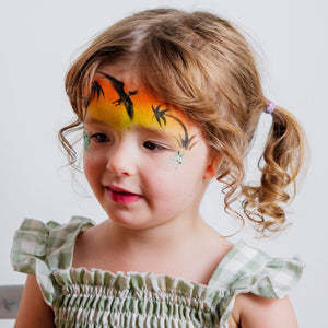 Close-up of the Dino & Dragon kit's water-based face paints and brushes
