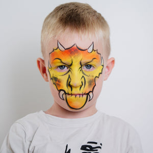 Child wearing a dragon face paint design from the Dino & Dragon kit
