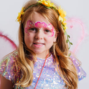 Parent painting a child's face at home using the Palette Pals FairyTales kit