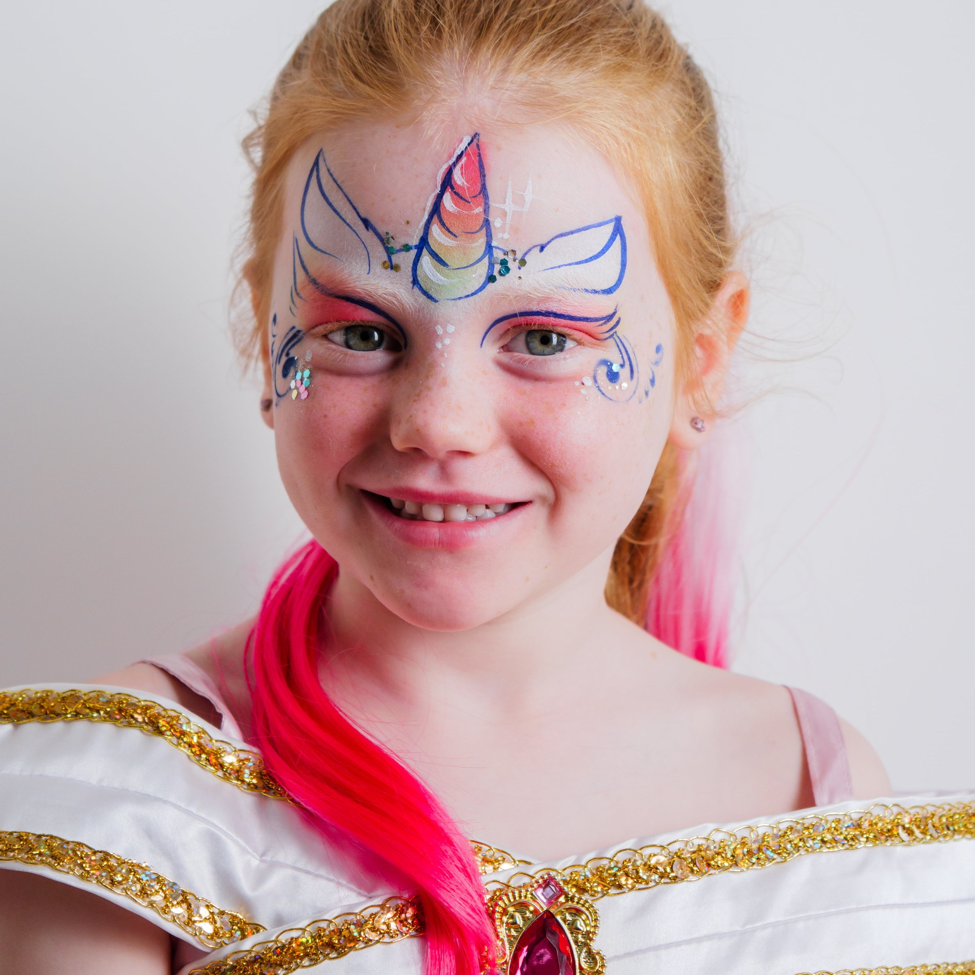 Close-up of the FairyTales kit's water-based face paints, glitter and brushes