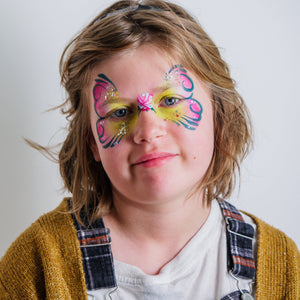 Child wearing a bee face paint design made with the Garden Party kit