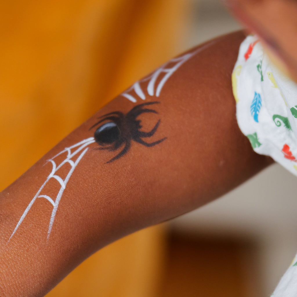 Close-up of the Garden Party kit's water-based face paints and brushes