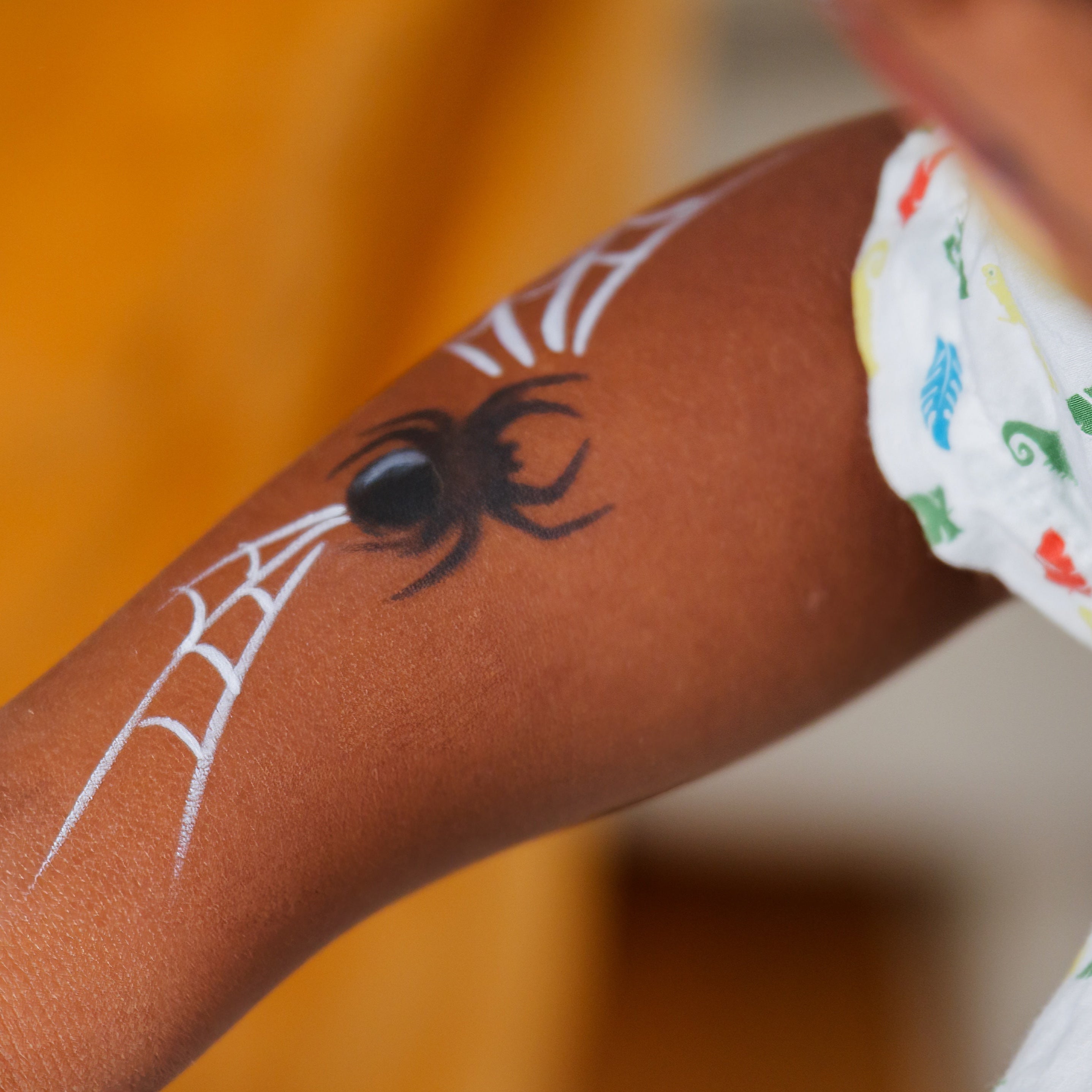 Close-up of the Garden Party kit's water-based face paints and brushes